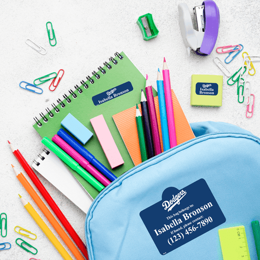 Part of deluxe school pack labels on backpack and school supplies.
