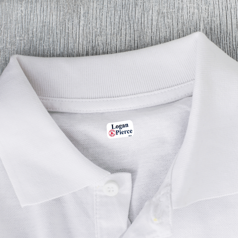 X-small clothing label on white shirt.