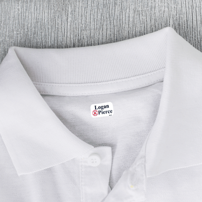 X-small clothing label on white shirt.
